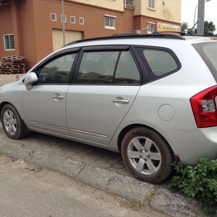 Bán xe Kia Carens đời 2009 chính chủ màu bạc