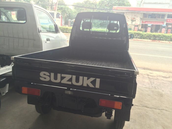 Cần bán xe Suzuki 650 kg thùng lửng màu xanh, giao xe ngay