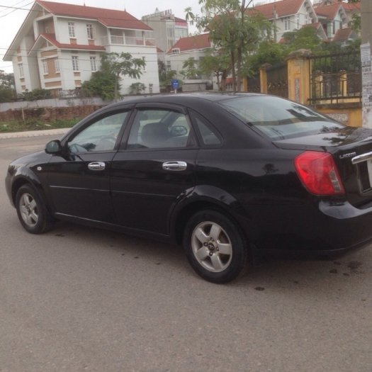 Gia đình cần bán xe Daewoo lacetti đời 2009, màu đen, biển Hà Nội