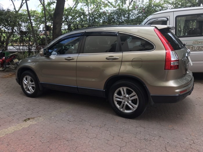 Bán xe Honda CRV còn mới, xe đẹp sx 2011 bản 2.4 tự động màu vàng cát.