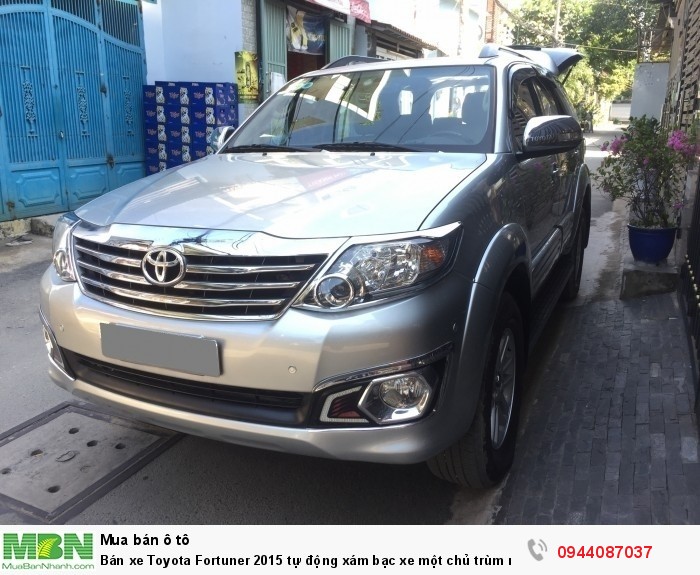 Bán xe Toyota Fortuner 2015 tự động xám bạc xe một chủ trùm mền