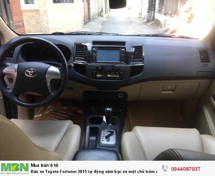 Bán xe Toyota Fortuner 2015 tự động xám bạc xe một chủ trùm mền