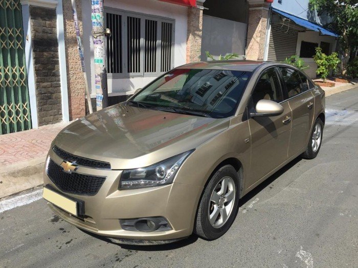 bán xe Chevrolet Cruze 2013 số sàn màu gold zin nguyên con