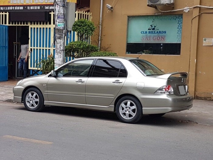 Bán em Mitsubishi Lancer 2005 đk 2007 tự động màu vàng đẹp
