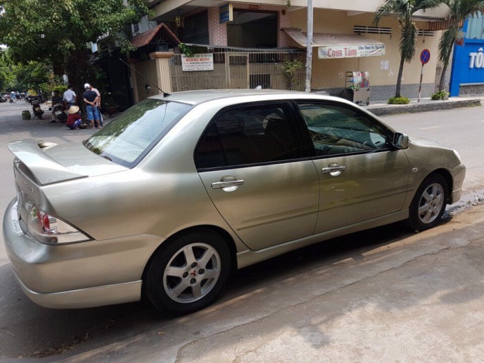 Bán em Mitsubishi Lancer 2005 đk 2007 tự động màu vàng đẹp