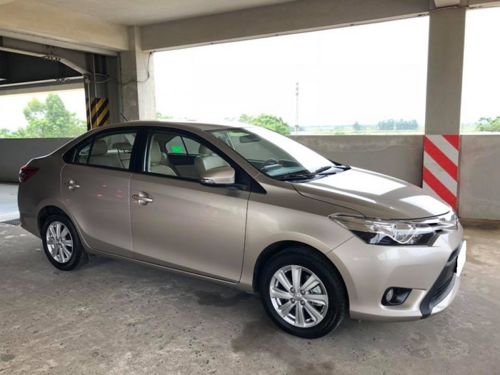 Cần bán gấp xây nhà xe Toyota  Vios đời 2016,số tự động màu vàng cát