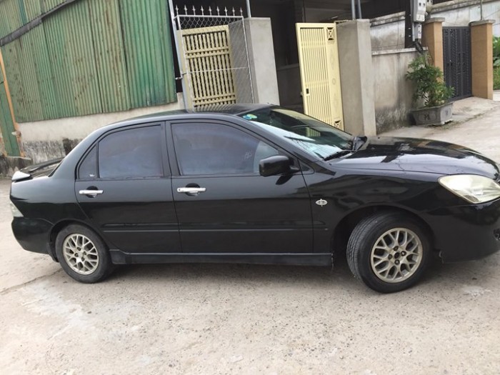 Cần bán xe Mitsubishi Lancer 1.8AT 2003 màu đen cọp