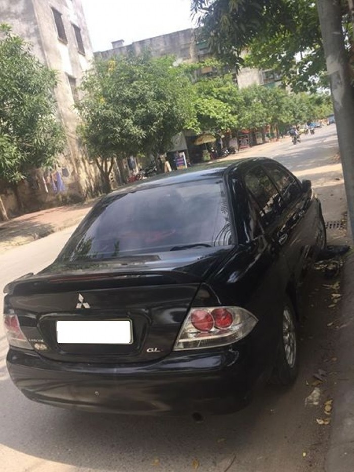 Cần bán xe Mitsubishi Lancer 1.8AT 2003 màu đen cọp