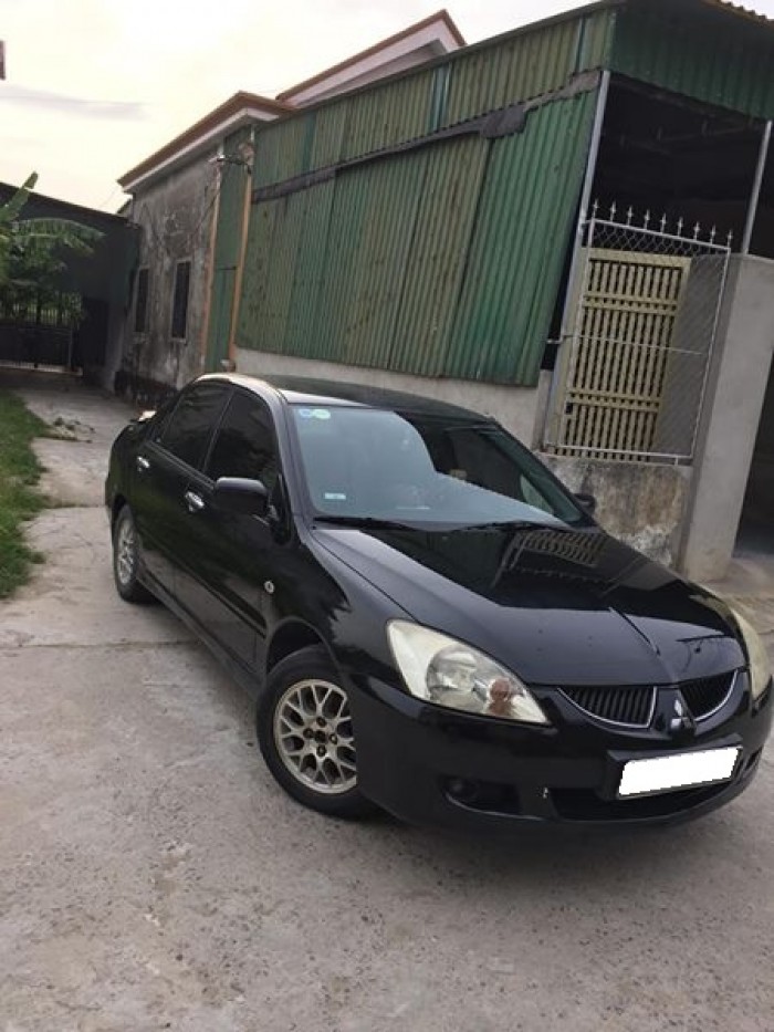 Cần bán xe Mitsubishi Lancer 1.8AT 2003 màu đen cọp