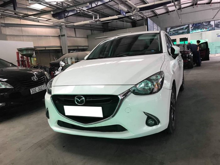 Cần tiền bán gấp Mazda 2 2016 số tự động . Xe màu trắng