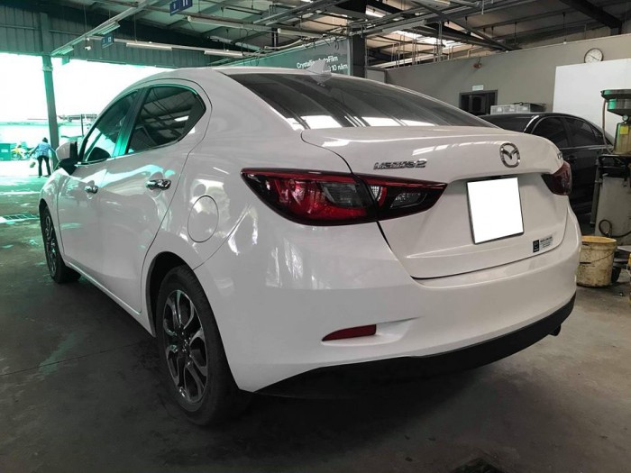 Cần tiền bán gấp Mazda 2 2016 số tự động . Xe màu trắng