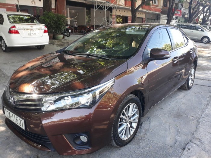 Bán Toyota Altis 1.8G màu nâu titan số tự động sản xuất cuối 2014 mới 90%