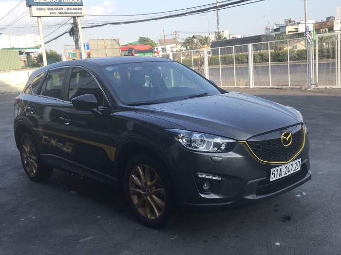 Bán Mazda CX-5 2.0AT màu nâu Titan số tự động sản xuất 2015 một chủ