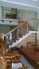 Cầu thang trụ inox bắt trên mặt, tay vịn gỗ vuông