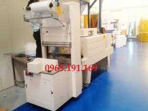 Máy cắt dán và co màng lốc chai bán tự động