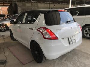 Bán Suzuki Swift 1.4AT màu trắng camay số tự động biển Sài Gòn sản xuất cuối 2016 chạy đúng 13000km