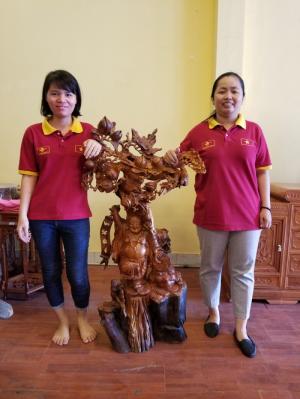 Di lặc gánh cành đào gỗ hương