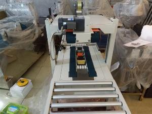 Máy dán băng dính thùng carton, máy dán thùng mặt trên mặt dưới bán tự động FXA6050
