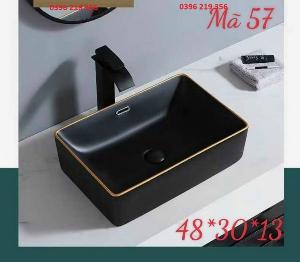 Bồn lavabo đen viền vàng